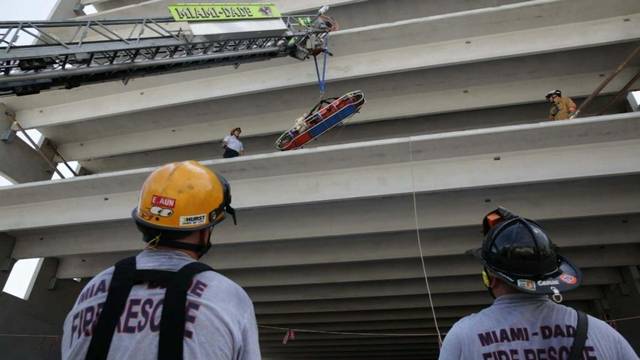 Concrete beam falls off crane, injuring two workers at Miami Dade College West