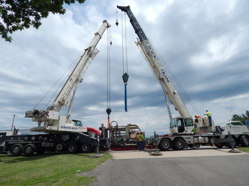 Cook Construction & Crane Service tandem lifts 153,000 pound Die-Cast Machine in recovery effort
