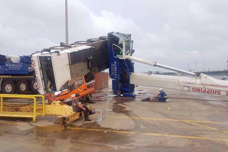 Two injured after mobile hyraulic truck crane tips over at Jurong Port, Singapore
