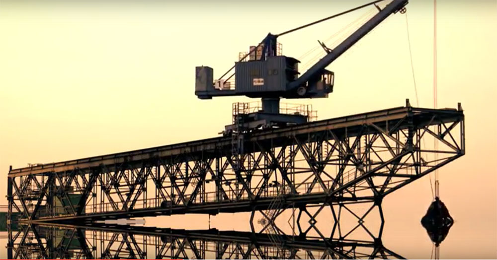 Very cool nine second timelapse video of trolley mounted lattice boom clam crane working at sunset