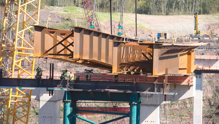 Watch video of the $230 million Kiewit project reach a milestone, the setting of 375t bridge girders with a 1375-ton crawler crane in MN