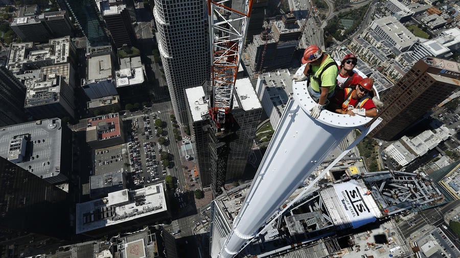 At 1,099 feet, Turner Construction Company uses a Tower Crane to set a 10-ton Spire atop the $1Billion Wilshire Grand Tower in LA