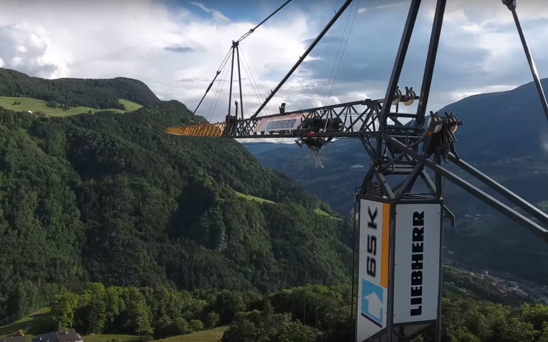 Drone Video of a Liebherr 65 K fast-erecting crane working at 6,876 feet at South a Tyrol Ski Resort.