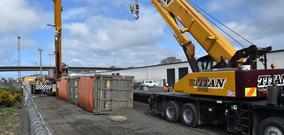 Titan Crane Hire brings in 2 cranes to upright an overturned rail crane in New Zealand