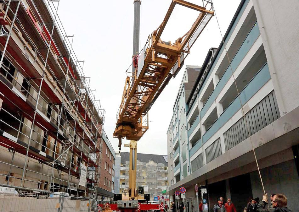 A Hess owned All Terrain Crane assembles a tower crane in Germany ...