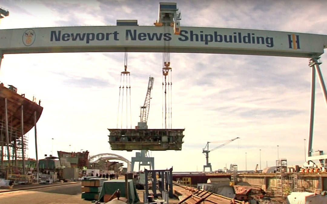 Watch 704-metric ton unit lifted by railed mounted gantry crane @ Newport News Shipyard