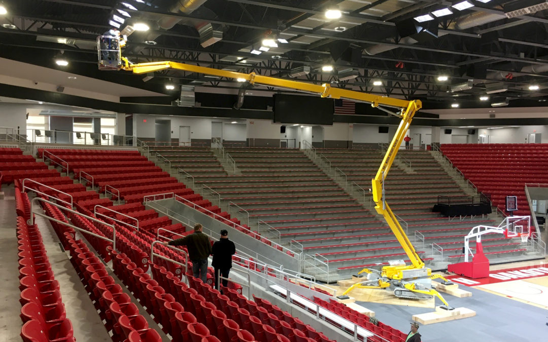 An Omme articulating crawler boom lift handles maintenance at the new Sanford Arena, University of South Dakota.