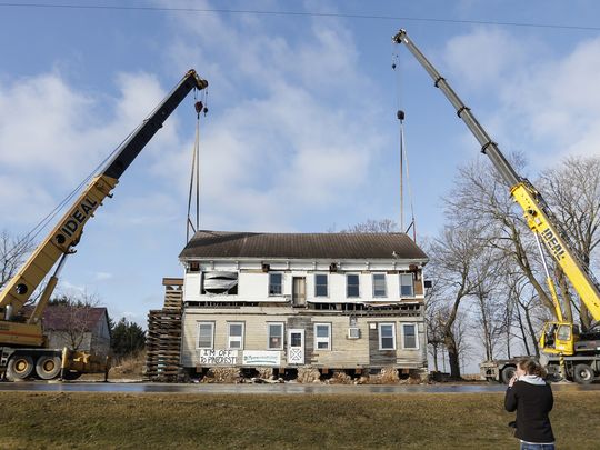 Ideal Crane Rental tandem lifts Historic Inn Roof with Grove Truck Cranes in Wisconsin