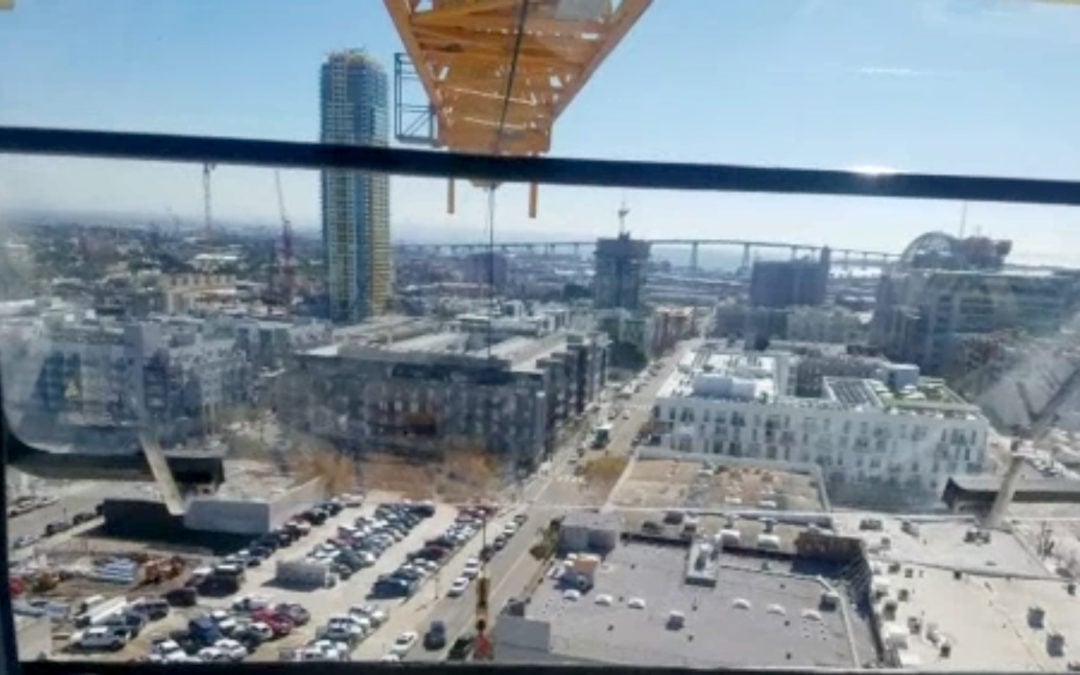 Tower Crane Operator Rescues Giant American Flags in San Diego
