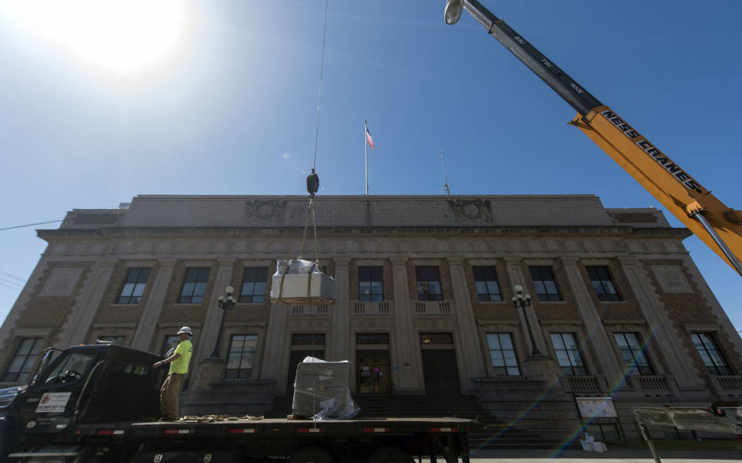 Ness Crane lifts roofing supplies at Historic Lewis County Courthouse in Chehalis, Washington.
