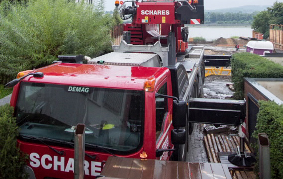 Schares Demag AC 160-5 All Terrain Crane with IC-1 plus erects tower crane in Germany