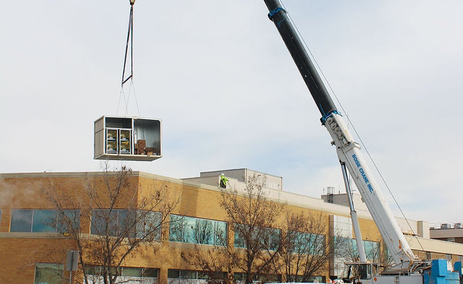 Boise Crane Inc. lift and sets large HVAC unit with an All Terrain in Oregon