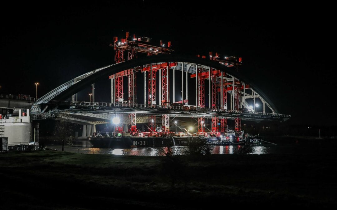 Mammoet moves 5,000-ton old Lek Bridge from 1936 at night in Vianen, Netherlands